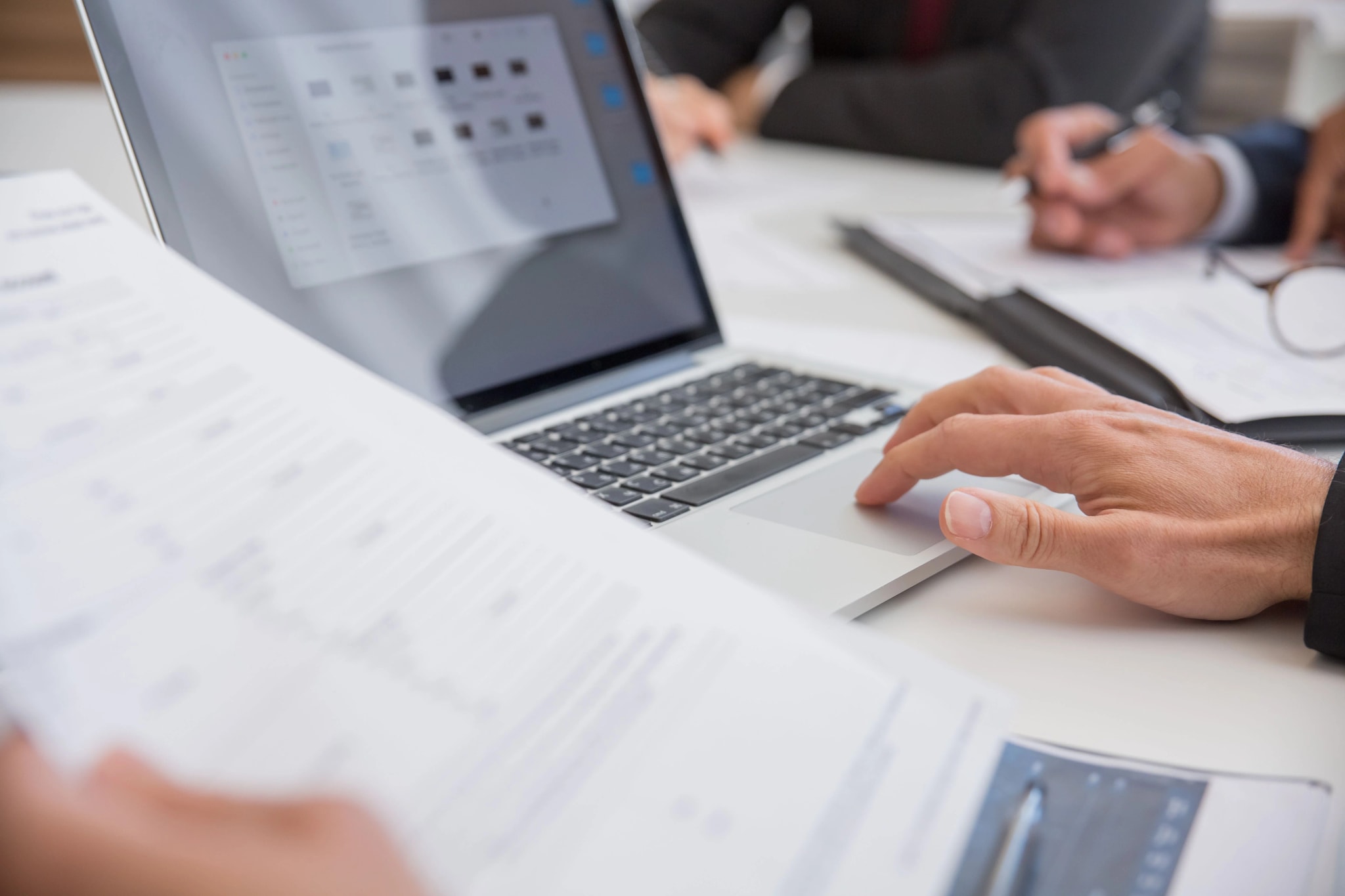 A document workflow showing a drafted report being reviewed and signed off by a specialist.